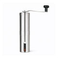 Molino manual para café portátil de acero inoxidable con manivela desmontable y ventana para visualizar el café molido.